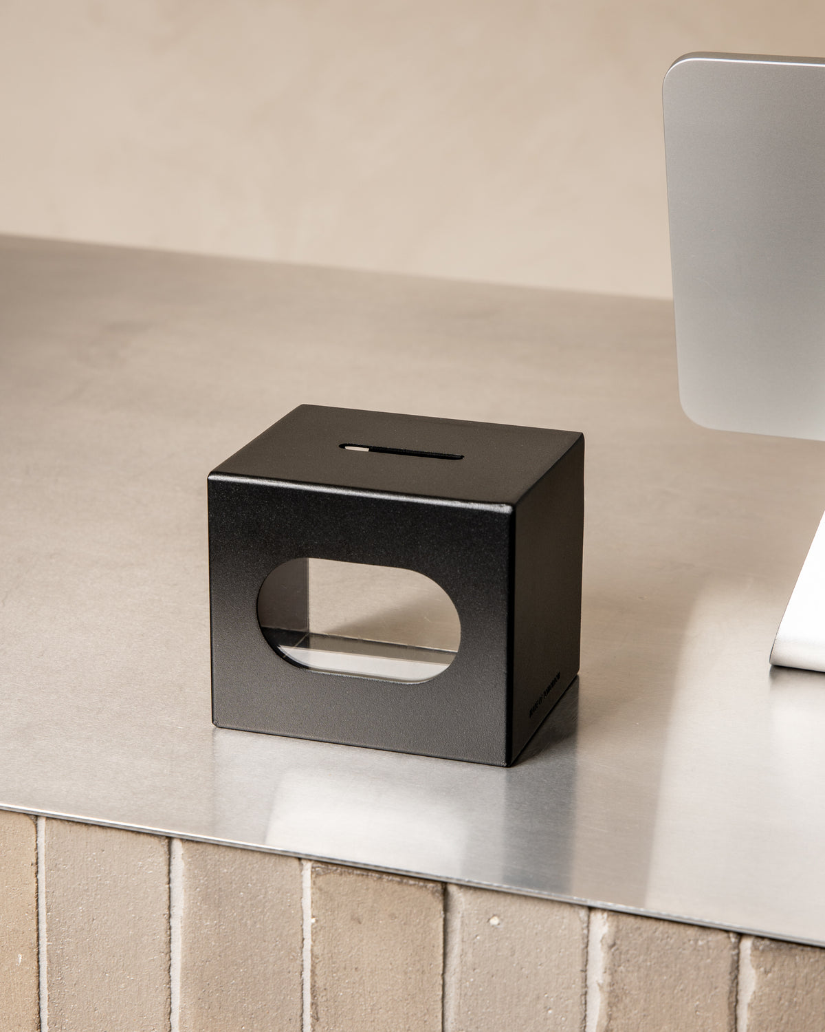 Black FOLD Tip Box on a countertop with the magnetic header removed