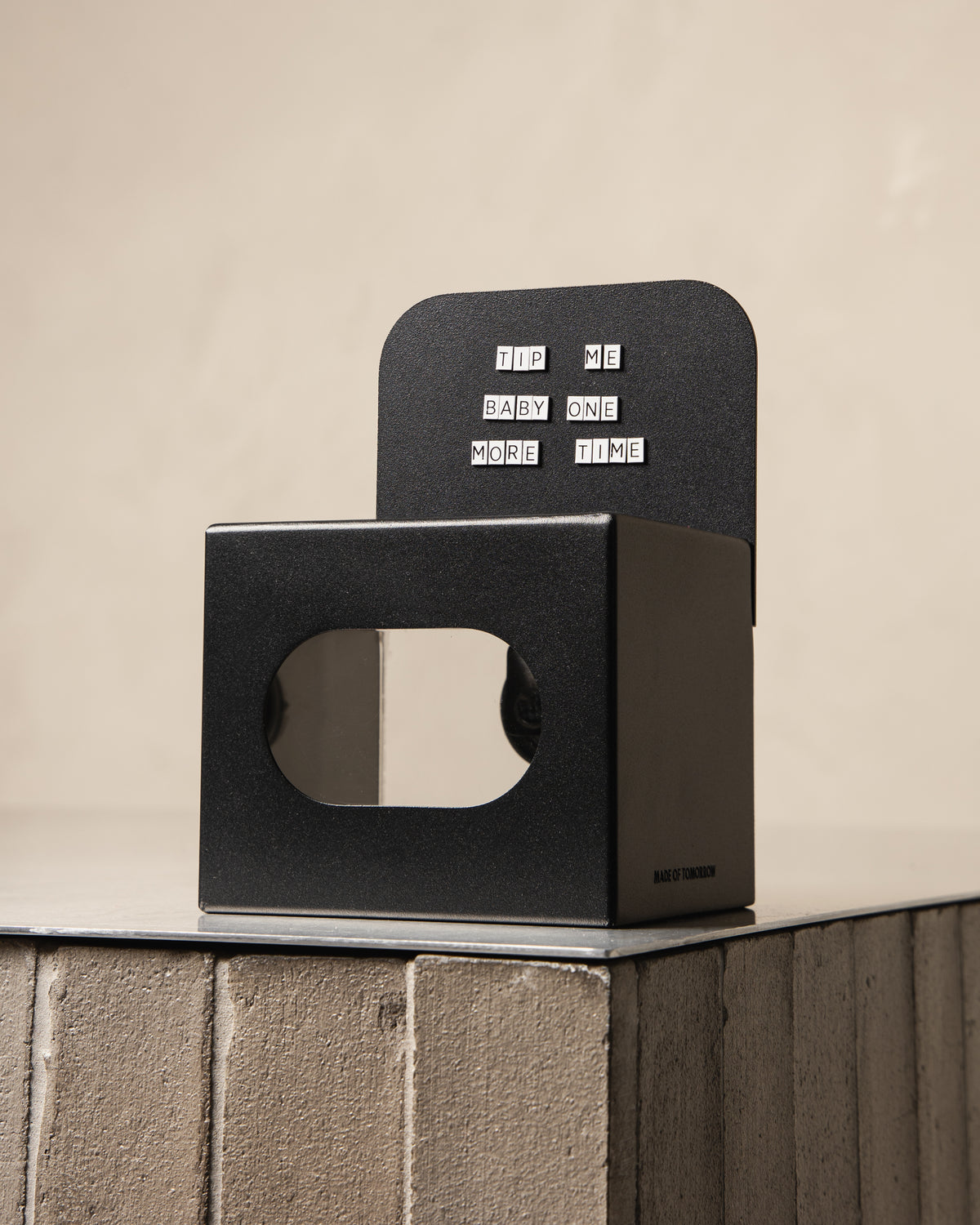 Black FOLD Tip Box with a magnetic message displayed on a tiled counter